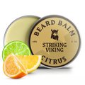 Citrus beard balm tin with lime and orange slice.