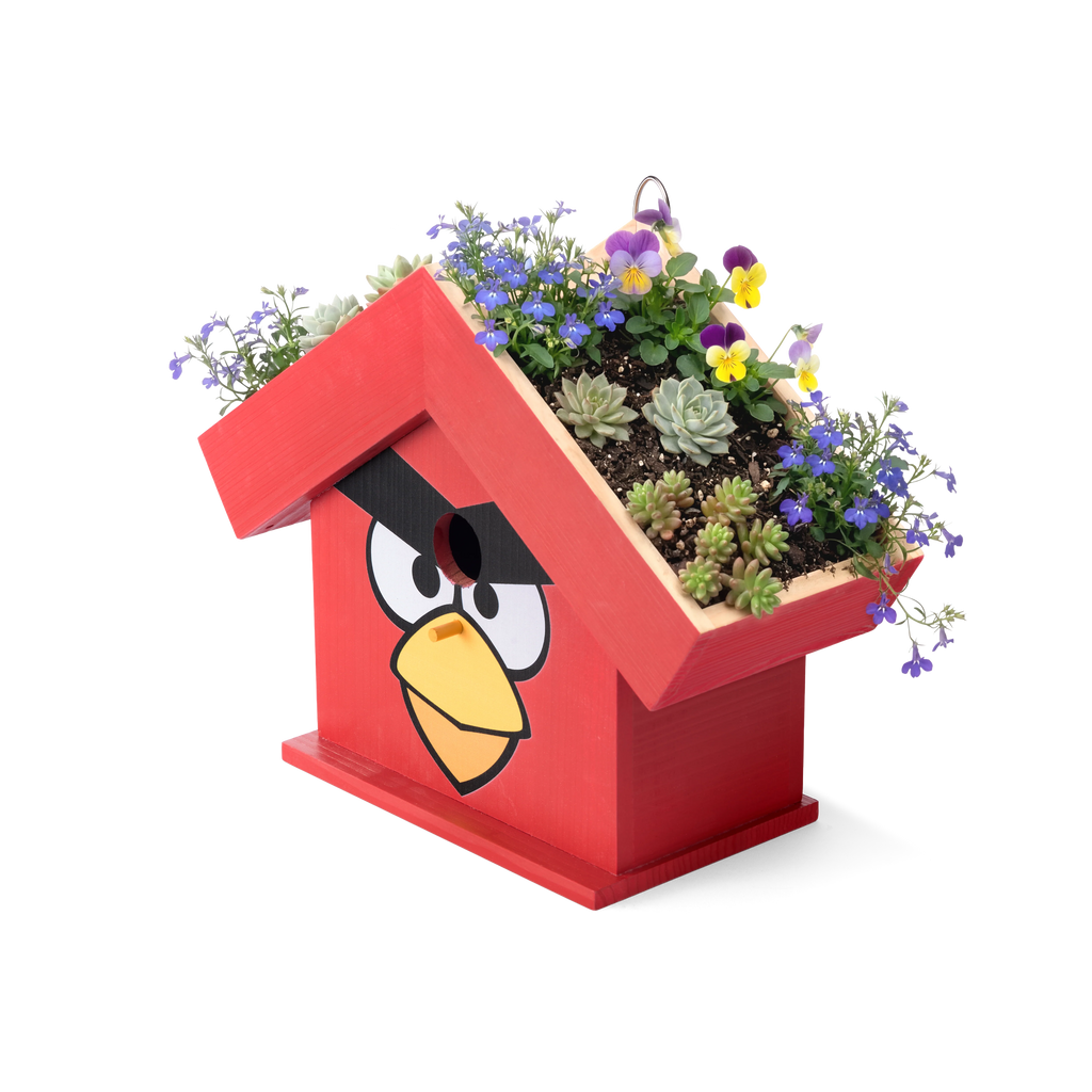 Top-angle view of the WildYard X Angry Birds™ Flowerpot Birdhouse rooftop planter filled with pansies, violas, succulents and wildflowers