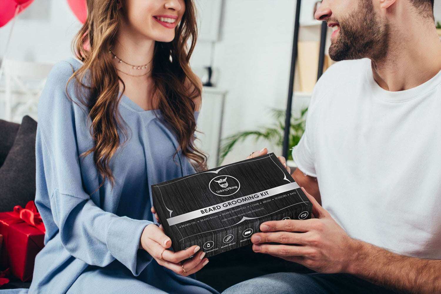 Beard grooming kit package held by a couple, showcasing a premium beard care set.